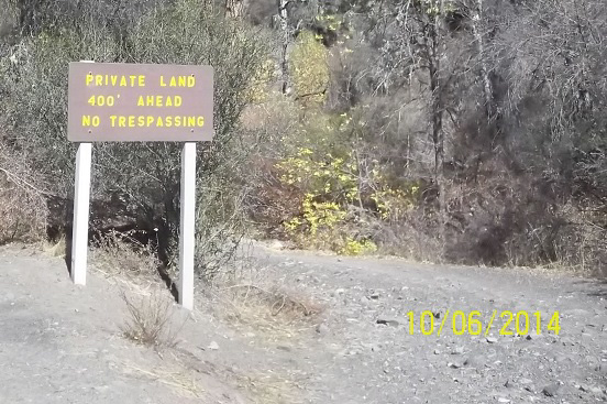 Sign: Private Land. 400'. No Trespassing.